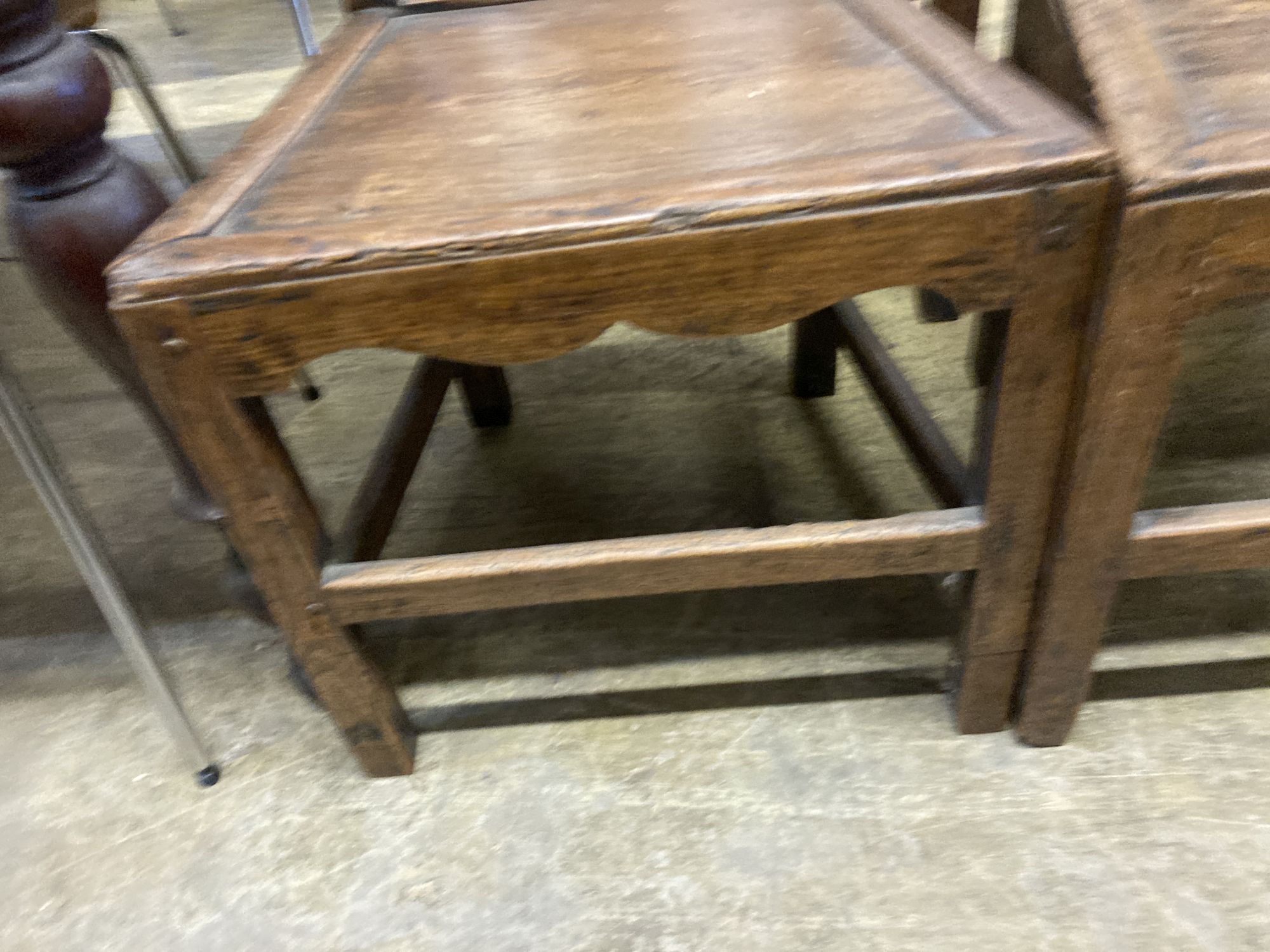 A set of four 18th century provincial elm wood seat dining chairs